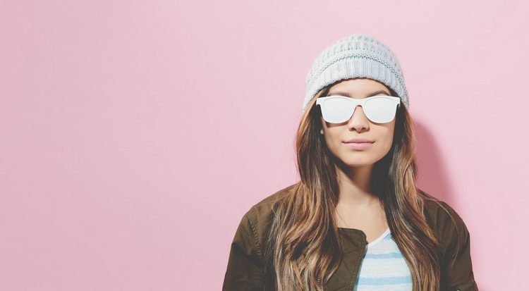 Hipster girl wearing sunglasses and hat