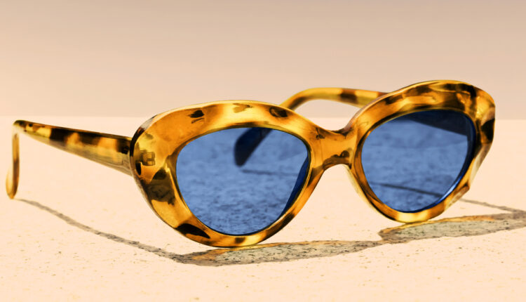 women’s sunglasses with black glasses in a yellow frame